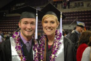 Dr. Mike and Dr. Rose undergraduate graduation photo. They are wearing cap and gown and Lei's.