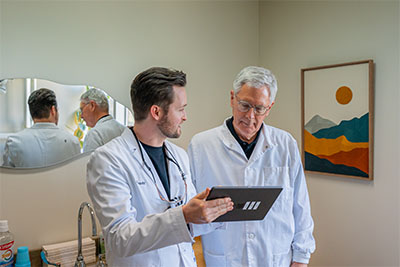 Dr Moody speaking with Dr. Baker about cosmetic dental options at uptown family dental.