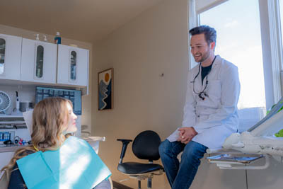 Dr. Moody discussing treatment options with a new dental patient