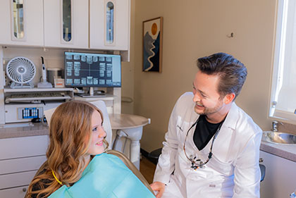 Dr Moody talking with a patient about restorative dental options. 